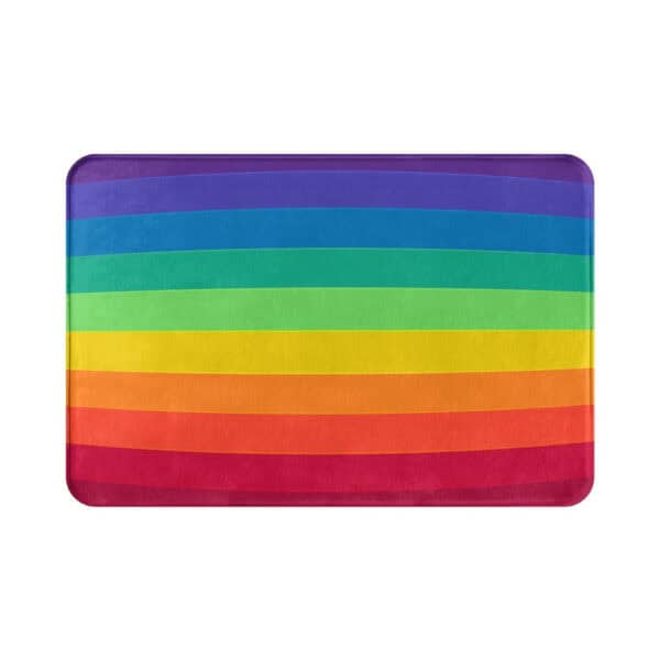 Rainbow colored bath mat with vibrant stripes for colorful bathroom decor.