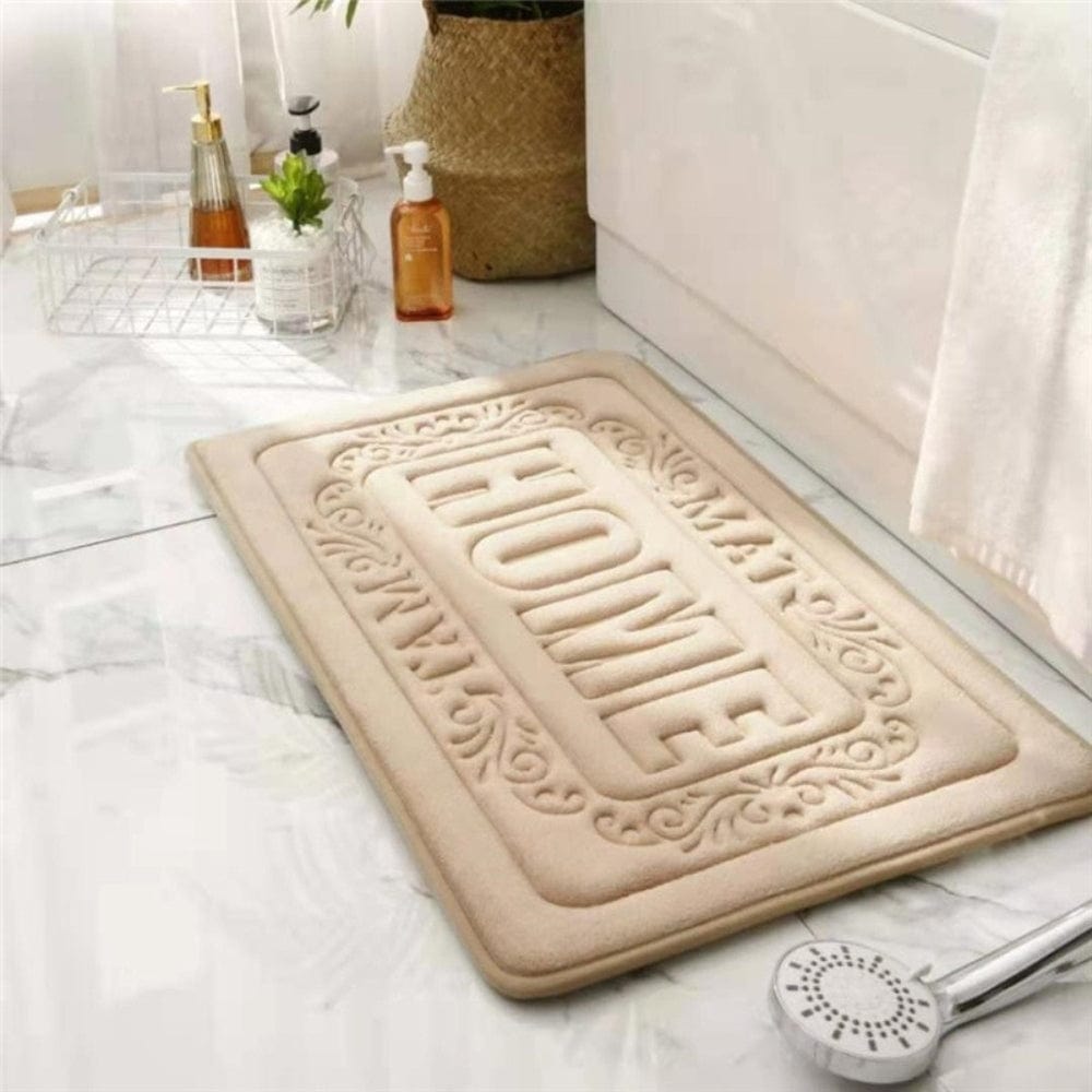 Rectangular bath mat with 'HOME' embossed design for bathroom decor.