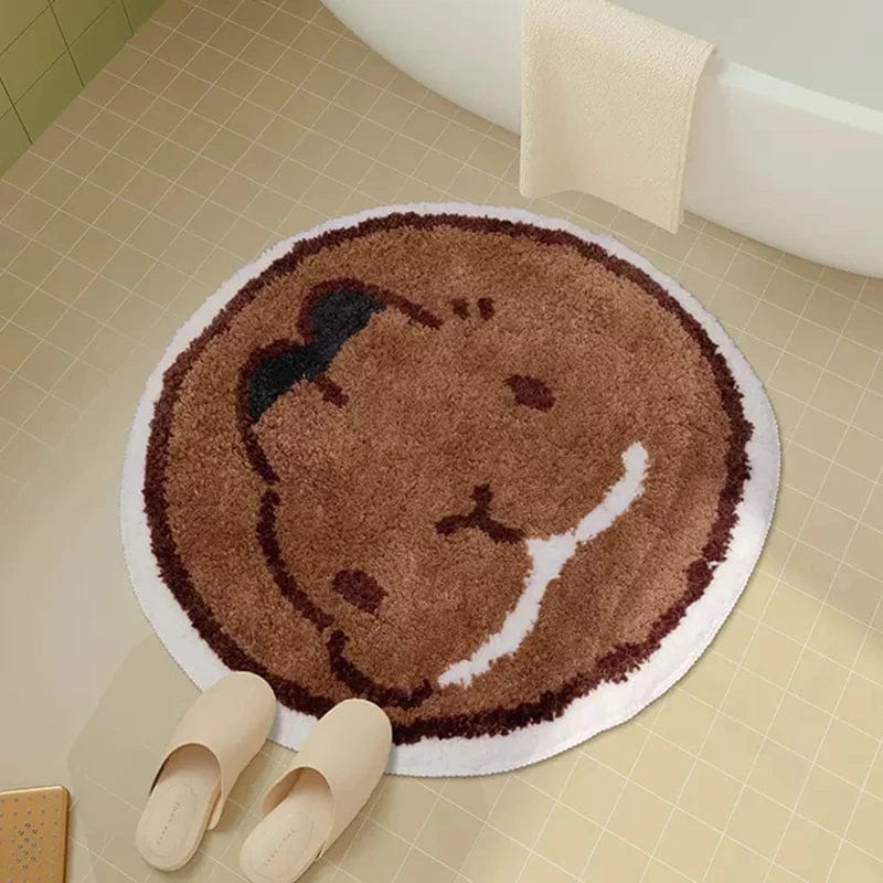 Round bath mat with cute bear design for cozy bathroom.