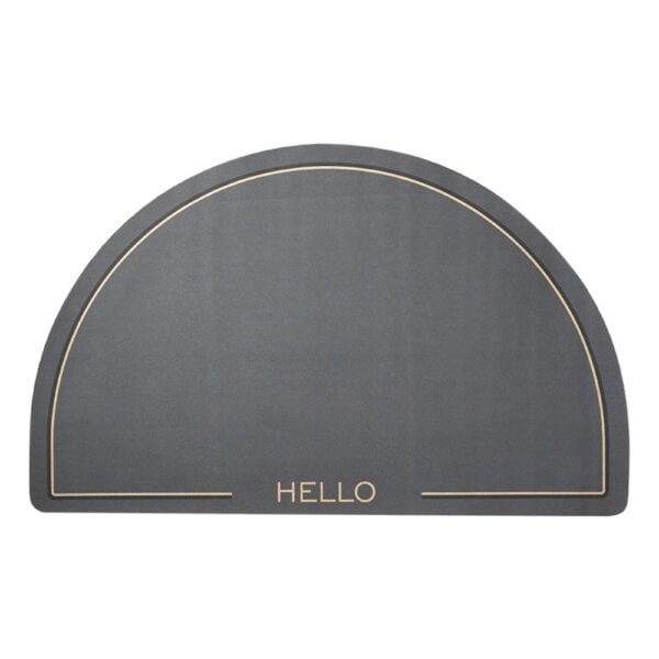 Semi-circle bath mat with 'HELLO' text and gold trim.