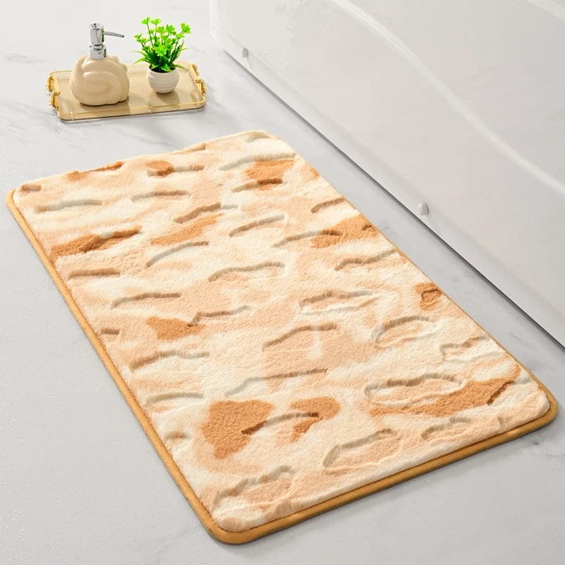 Shaggy bath mat with beige and tan pattern, soft texture, bathroom setting.