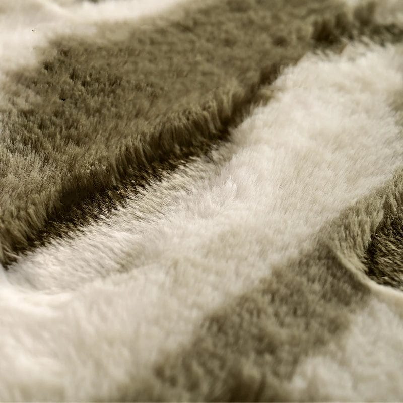 Shaggy bath mat with soft fluffy texture in beige and white.