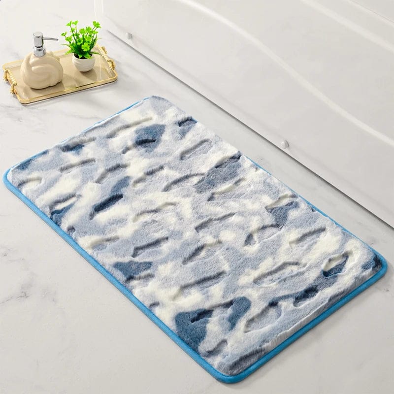 Shaggy bath mat with blue and white pattern, soft textured rug for bathroom.