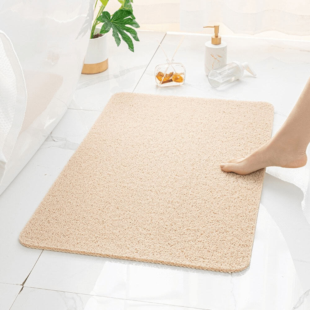 Non-slip shower bath mat in beige, soft texture, bathroom safety.