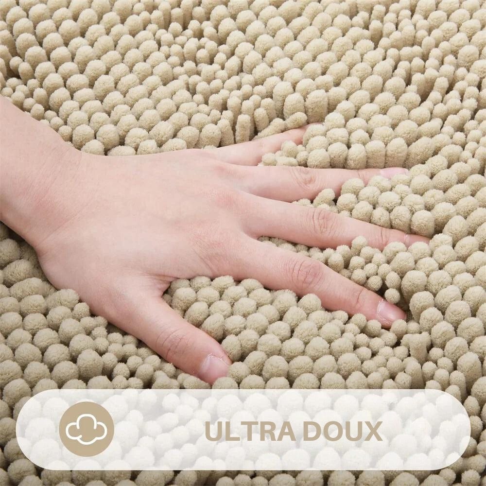 Soft textured bath mat with hand touching for comfort.