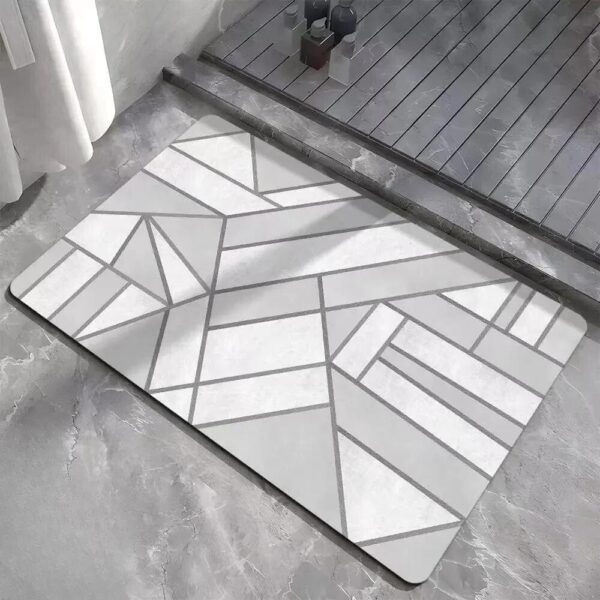 Small grey bath mat with geometric pattern for modern bathroom.