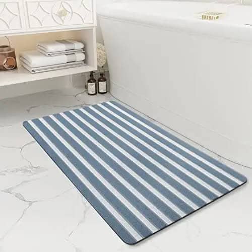 Blue and white striped step out bath mat for bathroom.