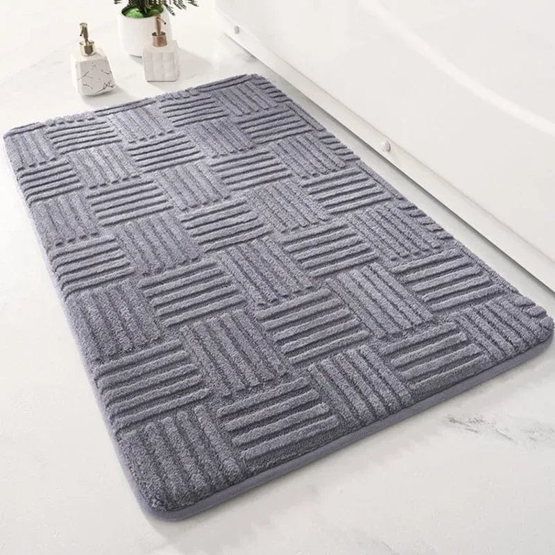 Super thick grey bath mat with textured pattern for comfort and grip.
