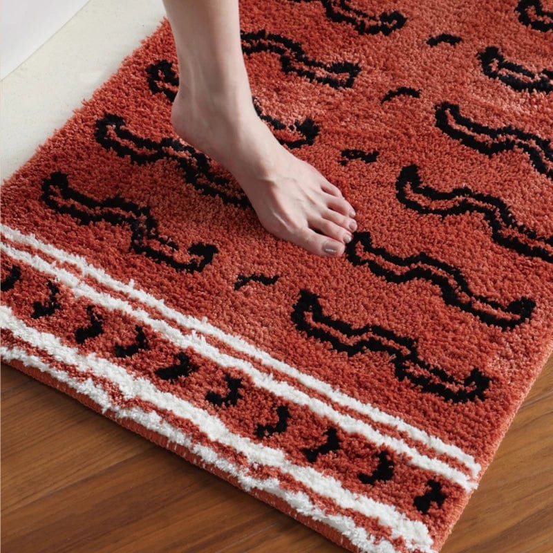 Tiger Print Bath Mat with Orange and Black Design.