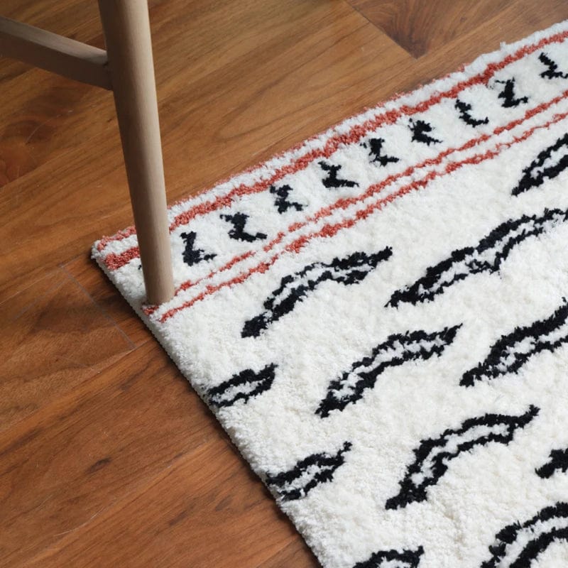 Tiger Print Bath Mat with Black and Red Tribal Design on White Background.