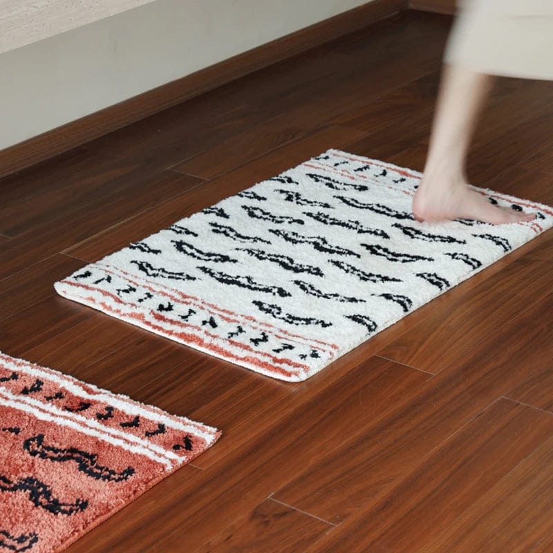 Tiger Print Bath Mat with Black and White Stripes on Wooden Floor.