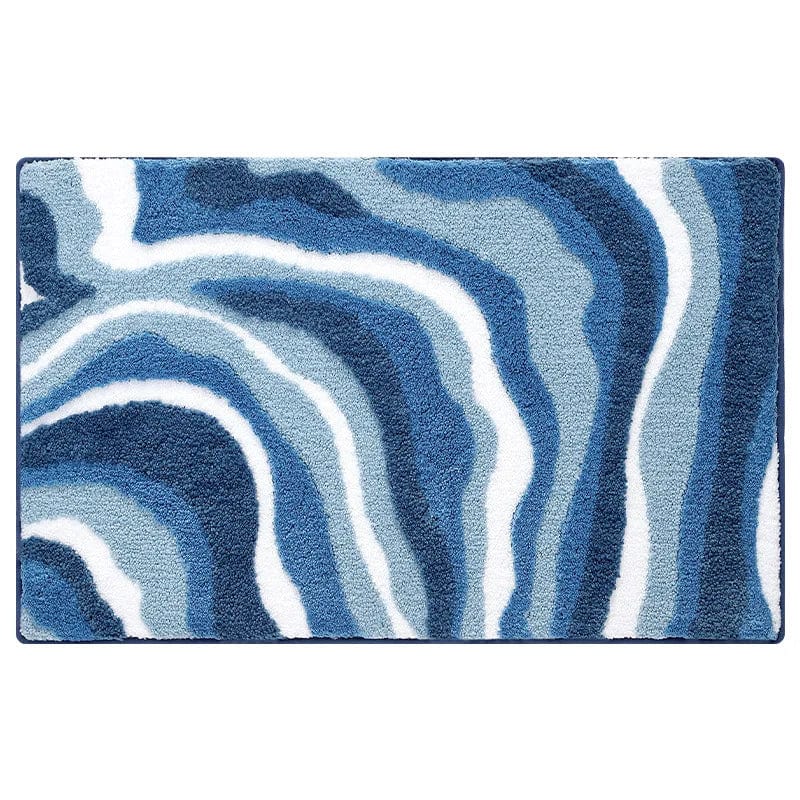Blue wave pattern bath mat for bathroom comfort and style.