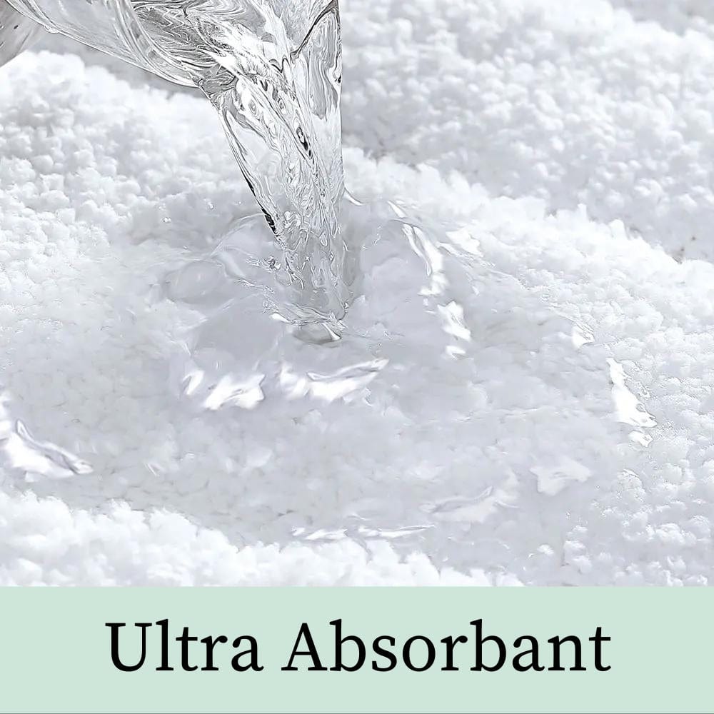 White luxury bath mat absorbing water quickly and effectively.